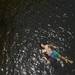 Ypsilanti resident Luke Stolarski floats on his back after jumping from a bridge above the Huron River near Barton Nature Area during unseasonably warm weather. Temperatures were in the mid-90s the week of June 19.
Jeffrey Smith | AnnArbor.com